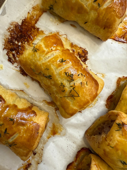 Freshly baked sausage roll with golden flaky pastry from Krumb Bakery Belfast