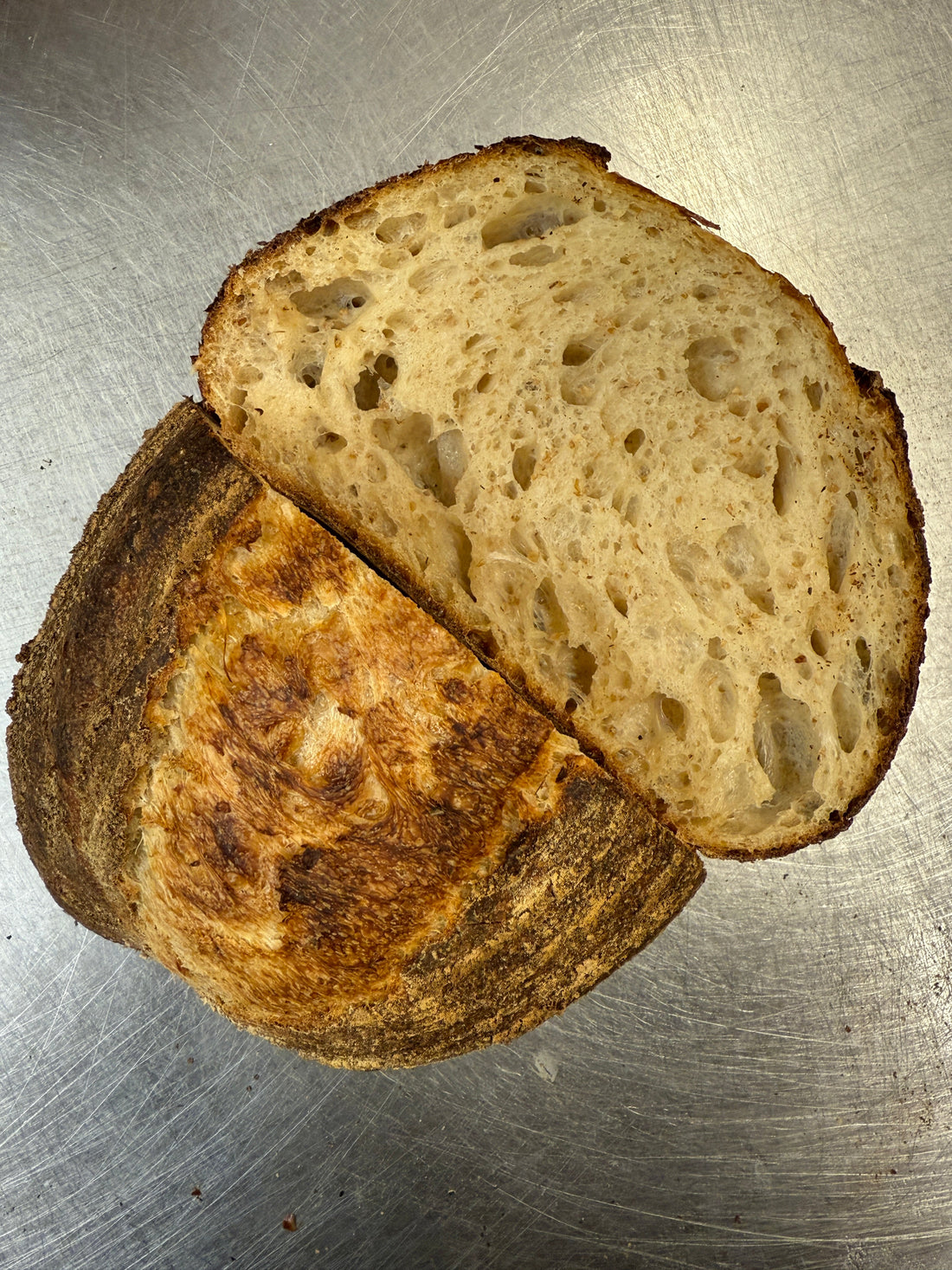 Freshly baked seeded sourdough loaf at Krumb artisan bakery in Belfast