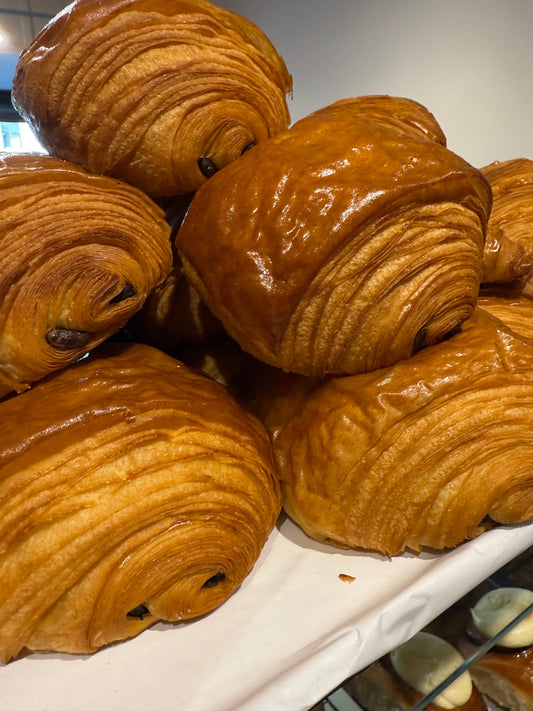 Pain au chocolat from Krumb Bakery Belfast, freshly baked with shatteringly crisp laminated layers and dark chocolate